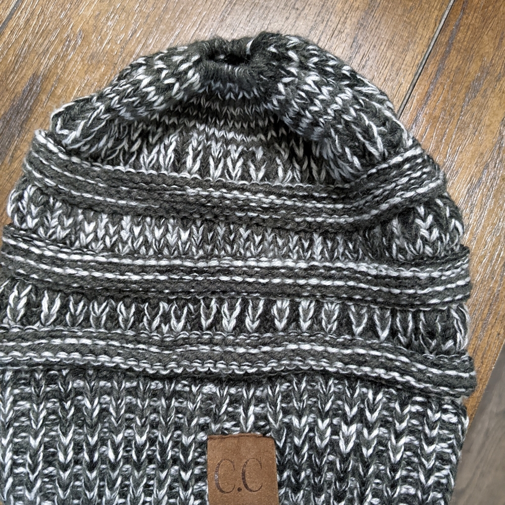 Women's Hat, with a ponytail or bun, open on top of the hat.